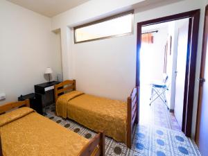 Postel nebo postele na pokoji v ubytování Aparthotel Amelia Dream View