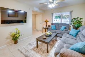 a living room with two couches and a table at Patio and Yard Sun City Home Near Casinos in Sun City