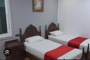 Katil atau katil-katil dalam bilik di Hotel Astoria Tanger