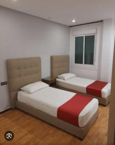 Katil atau katil-katil dalam bilik di Hotel Astoria Tanger