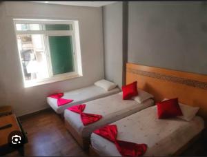 Katil atau katil-katil dalam bilik di Hotel Astoria Tanger