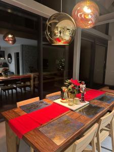a dining room table with a red napkin on it at high-Q in Kowalewo