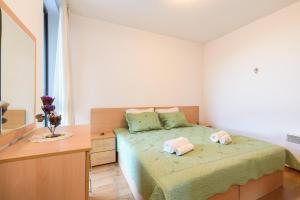 Ένα ή περισσότερα κρεβάτια σε δωμάτιο στο Niki's cosy place