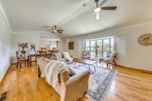 a living room with a couch and a table at Spacious Ruidoso Home with Patio and Mountain Views! in Ruidoso
