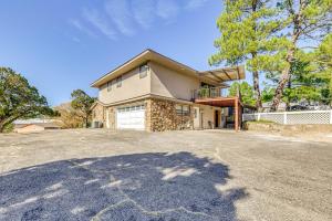 a house with a large driveway in front of it at Spacious Ruidoso Home with Patio and Mountain Views! in Ruidoso