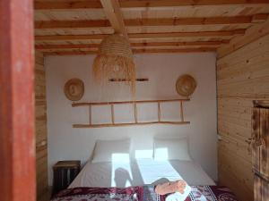 Postel nebo postele na pokoji v ubytování Aftass Hostel