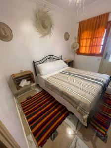 Postel nebo postele na pokoji v ubytování Aftass Hostel