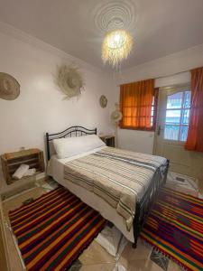 Postel nebo postele na pokoji v ubytování Aftass Hostel