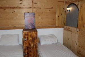 Postel nebo postele na pokoji v ubytování Aftass Hostel