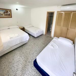 Postel nebo postele na pokoji v ubytování Hotel Casa Fátima