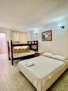 Postel nebo postele na pokoji v ubytování Hotel Casa Fátima