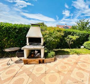 a bird house sitting on top of a patio at Beausoleil SPA Villa L-Geneva, Lake, Mountains-Full Love Stay-SPA optional extra fee in Chens-sur-Léman