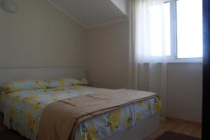 Postel nebo postele na pokoji v ubytování Apartment Frzop