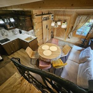 an overhead view of a kitchen and a table and chairs at Domek góralski z sauną i jacuzzi 2 in Kościelisko