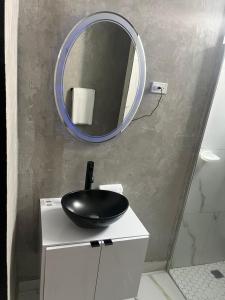 a bathroom with a black sink and a mirror at Molinos House 1 in Santa Isabel
