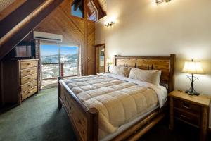 a bedroom with a large bed and a window at Cozy Rustic Escape Near Park City Adventures in Park City