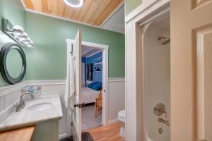 a bathroom with a sink and a toilet at Knoxville Home On-Site Hiking and Outdoor Kitchen! in Knoxville +30 photos