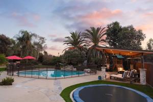 a backyard with a swimming pool and a pavilion at Stunning Private Resort with Pool in San Marcos