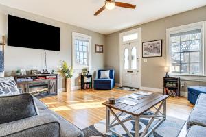 a living room with a couch and a tv at East End River Retreat Dogs Welcome! in Madison