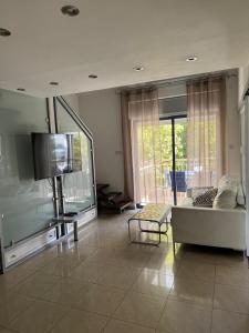 Posezení v ubytování Royal Park Eilat двухуровневая квартира + 26 fotografií
