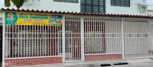 a white fence on the side of a building at Villa Campestre SAN JOSÉ in Guamo +28 photos