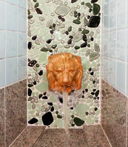a statue of a lion in a shower with water at TRIANGLEosaka in Osaka +62 photos
