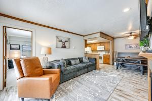 a living room with a couch and a chair at Brian Head Condo with Pool Access - Steps to Resort! in Brian Head