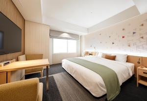 Letto o letti in una camera di Tokyu Stay Kanazawa
