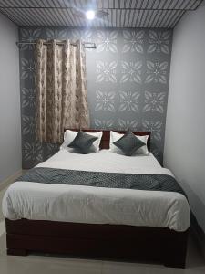 Postel nebo postele na pokoji v ubytování Radhika Hotel + 37 fotografií