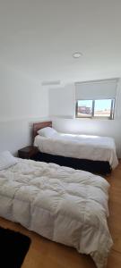 Postel nebo postele na pokoji v ubytování Depto Cerca Reloj Flores Viña