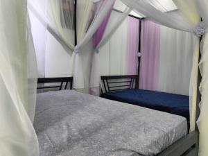 a bedroom with two beds in a tent at Yên Homestay Đơn Dương in Da Lat