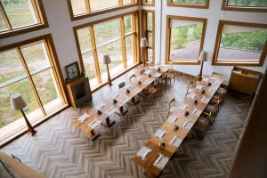 an overhead view of a large room with tables and windows at Wyndham Residences Aqkol in Akkol'