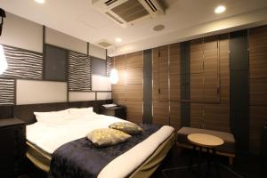 Postel nebo postele na pokoji v ubytování Hotel K Omiya (Adult Only)