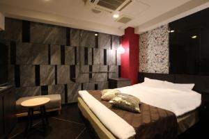 Postel nebo postele na pokoji v ubytování Hotel K Omiya (Adult Only)