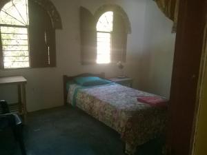Postel nebo postele na pokoji v ubytování El Garaje Hostal