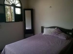 Postel nebo postele na pokoji v ubytování El Garaje Hostal