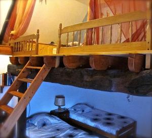 a bedroom with a bunk bed and a bunk bed at Kerarz - Chambre d'hôtes in Mauron