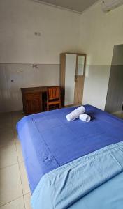 Postel nebo postele na pokoji v ubytování Ady Homestay