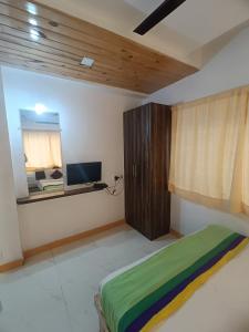 Postel nebo postele na pokoji v ubytování Hotel Green Woods