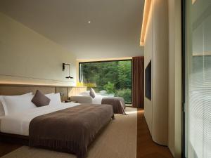 Zhangjiajie Juanjie Luxury Resorts--Provide free one-way airport pick-up service客房内的一张或多张床位