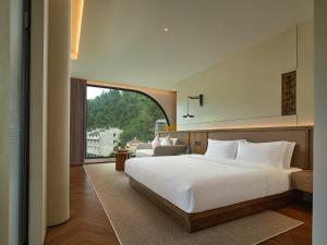 Zhangjiajie Juanjie Luxury Resorts--Provide free one-way airport pick-up service客房内的一张或多张床位