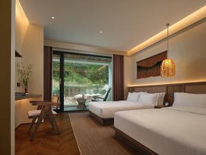 Zhangjiajie Juanjie Luxury Resorts--Provide free one-way airport pick-up service客房内的一张或多张床位