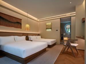 Zhangjiajie Juanjie Luxury Resorts--Provide free one-way airport pick-up service客房内的一张或多张床位
