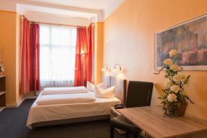 Cama ou camas em um quarto em Hotel am Hermannplatz