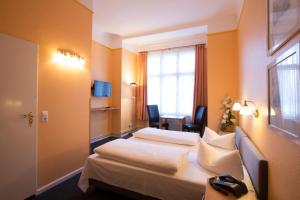 Säng eller sängar i ett rum på Hotel am Hermannplatz