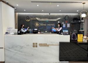 two women standing at a bar at a hotel at Bentley Hotel in Zhongli