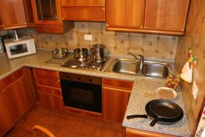 A kitchen or kitchenette at Appartamenti Giacomo Noventa