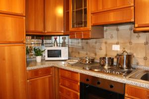 A kitchen or kitchenette at Appartamenti Giacomo Noventa