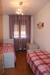 A bed or beds in a room at Appartamenti Giacomo Noventa