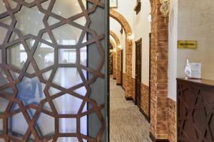 a door with a geometric design in a hallway at Qo'noq Tashkent Airport Hotel Sleep Lounge & Showers, Terminal 2 - TRANSIT ONLY in Tashkent